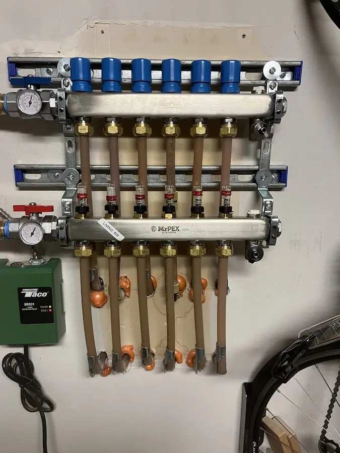 Plumber performing Water Heater Repair at a residential property in Madison